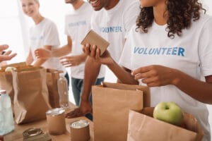 volunteers packing food and drinks for charity